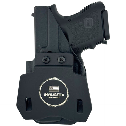 Black gun holster with 'Lindahl Holsters' logo on a white background