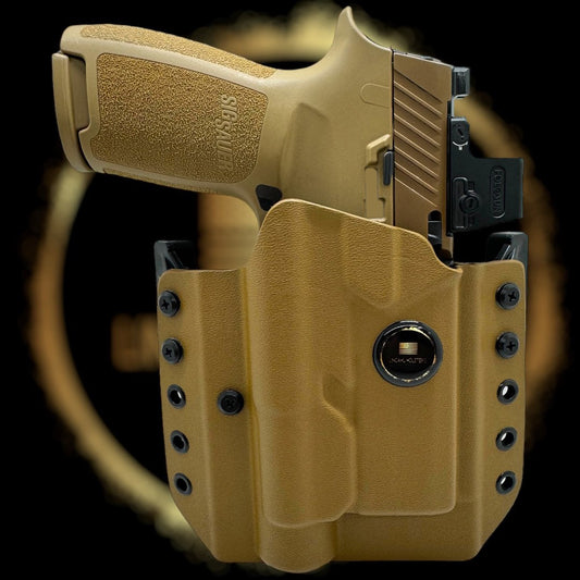 Tan handgun and holster set against a black background