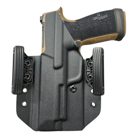Sig Sauer handgun in a black holster on a white background