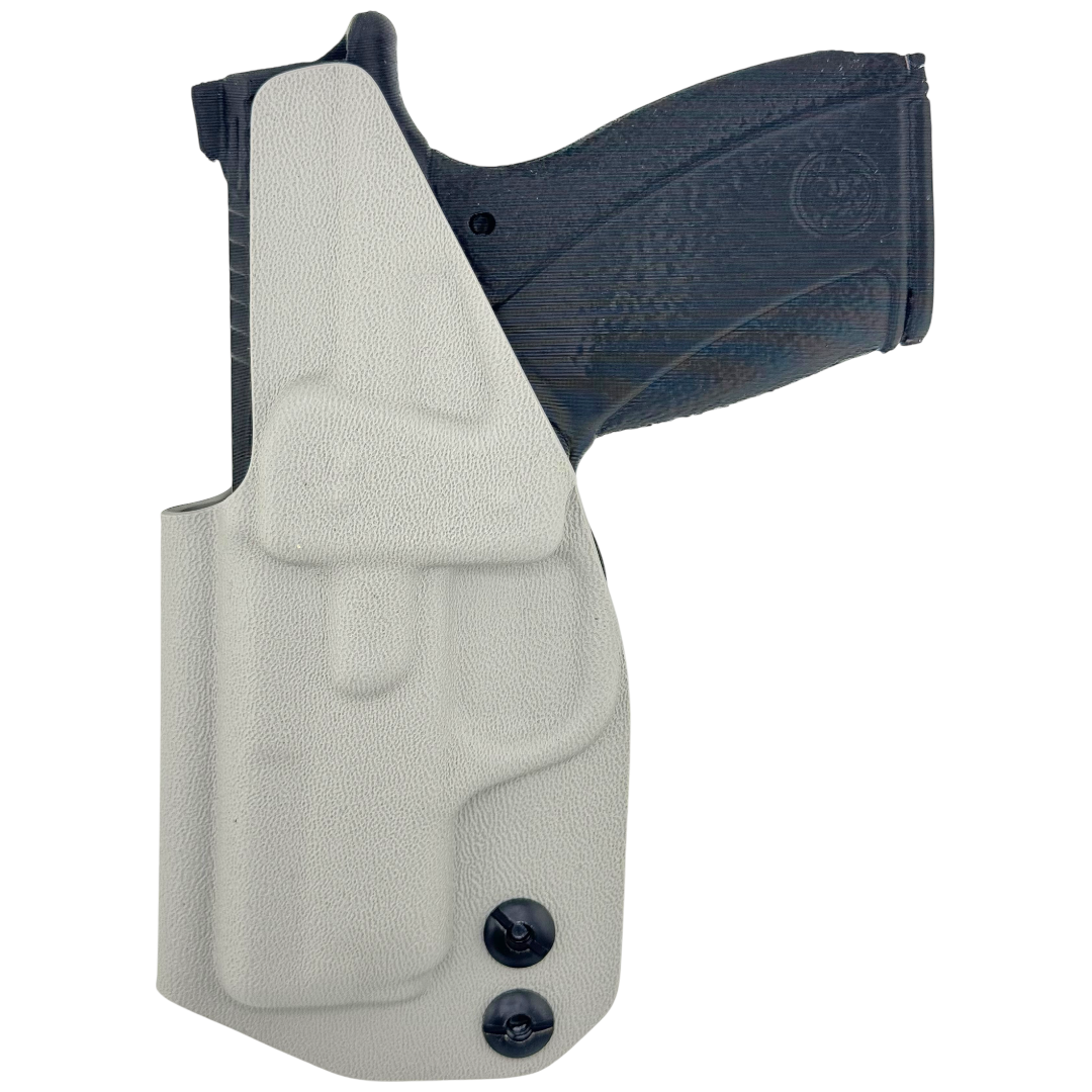 Gray holster with a black gun inside on a white background