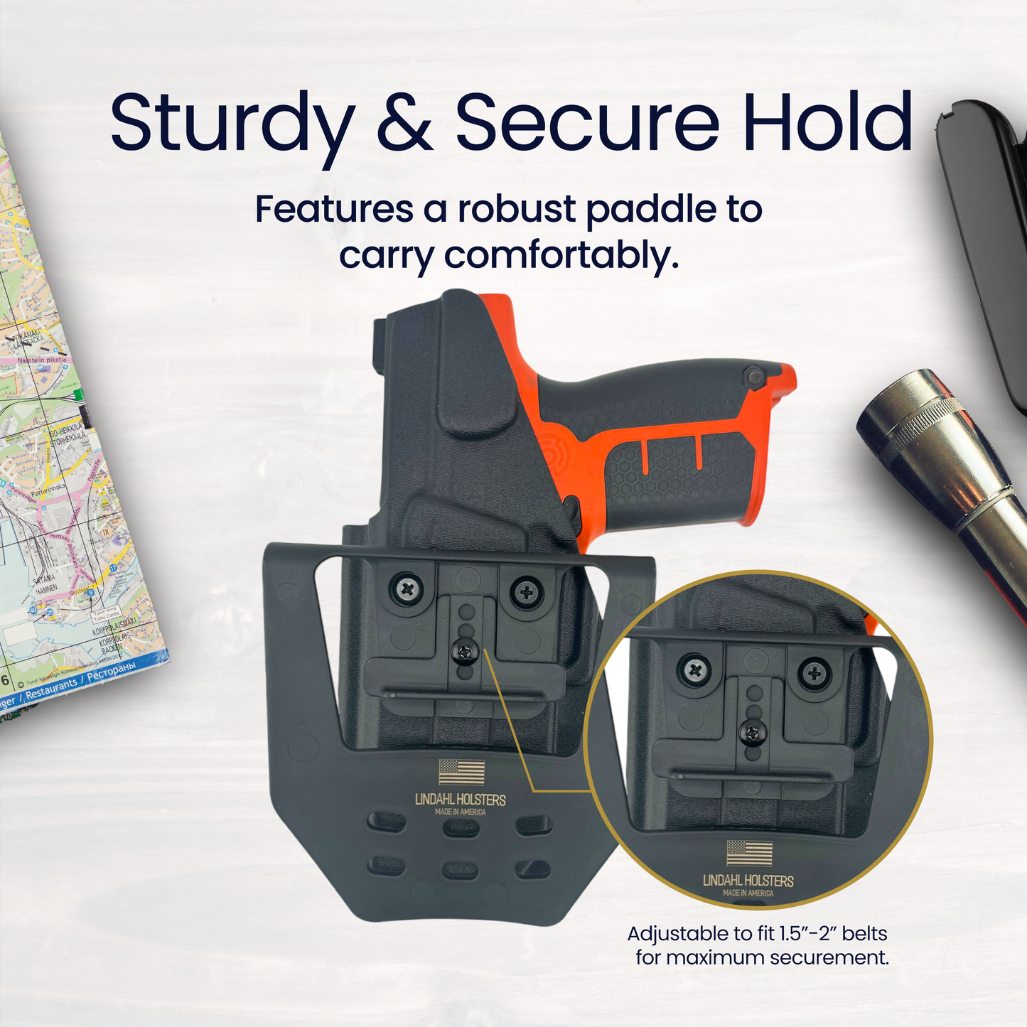 Holster with paddle for carrying a firearm, featuring adjustable belt fit and robust design.