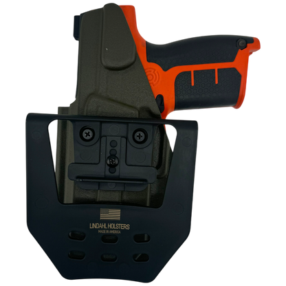 Black gun holster with orange gun on a white background