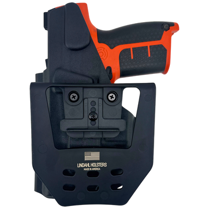 Black and orange gun holster with visible brand logo on a white background