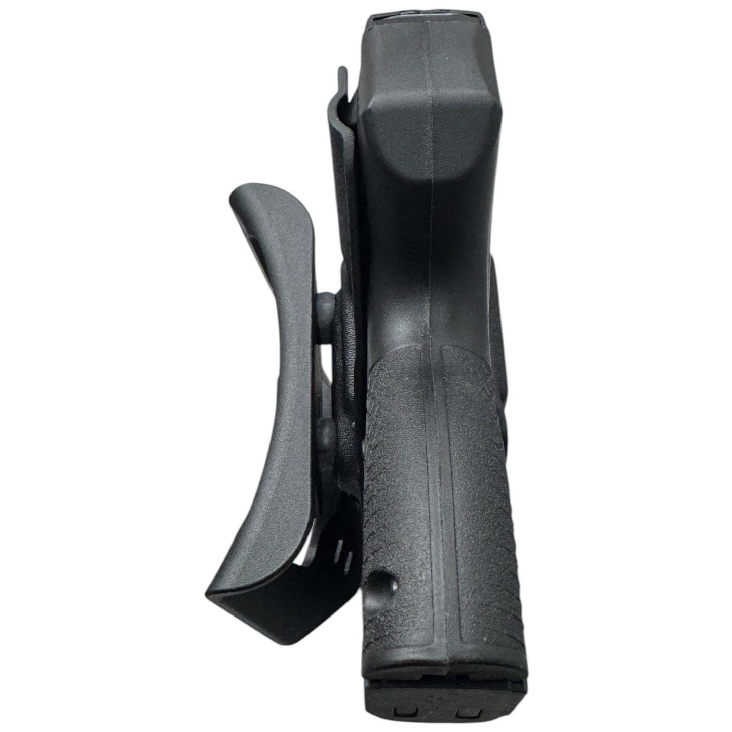 A black polymer belt holster shown from a side profile view, containing a handgun grip, on a solid white background.