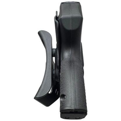 A black polymer belt holster shown from a side profile view, containing a handgun grip, on a solid white background.