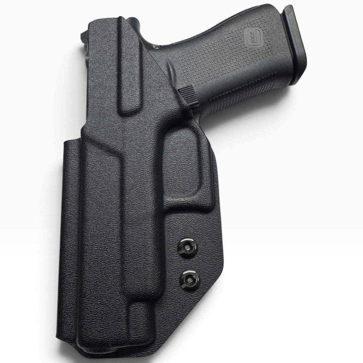 A black textured polymer or leather holster containing a handgun, photographed on a clean white background.