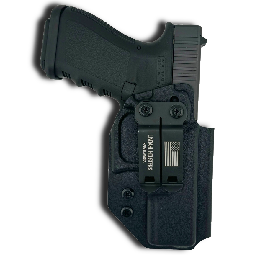 Black handgun with holster on a white background