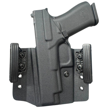 Black gun holster with a gun inside on a white background
