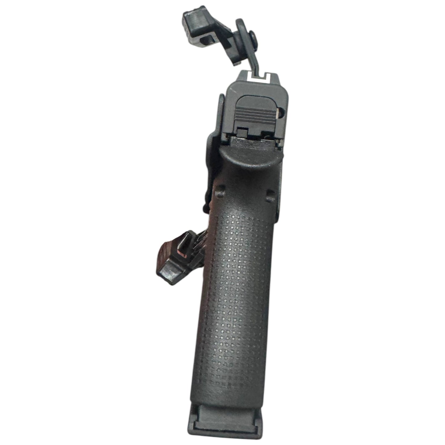 Black gun grip with textured surface on a white background