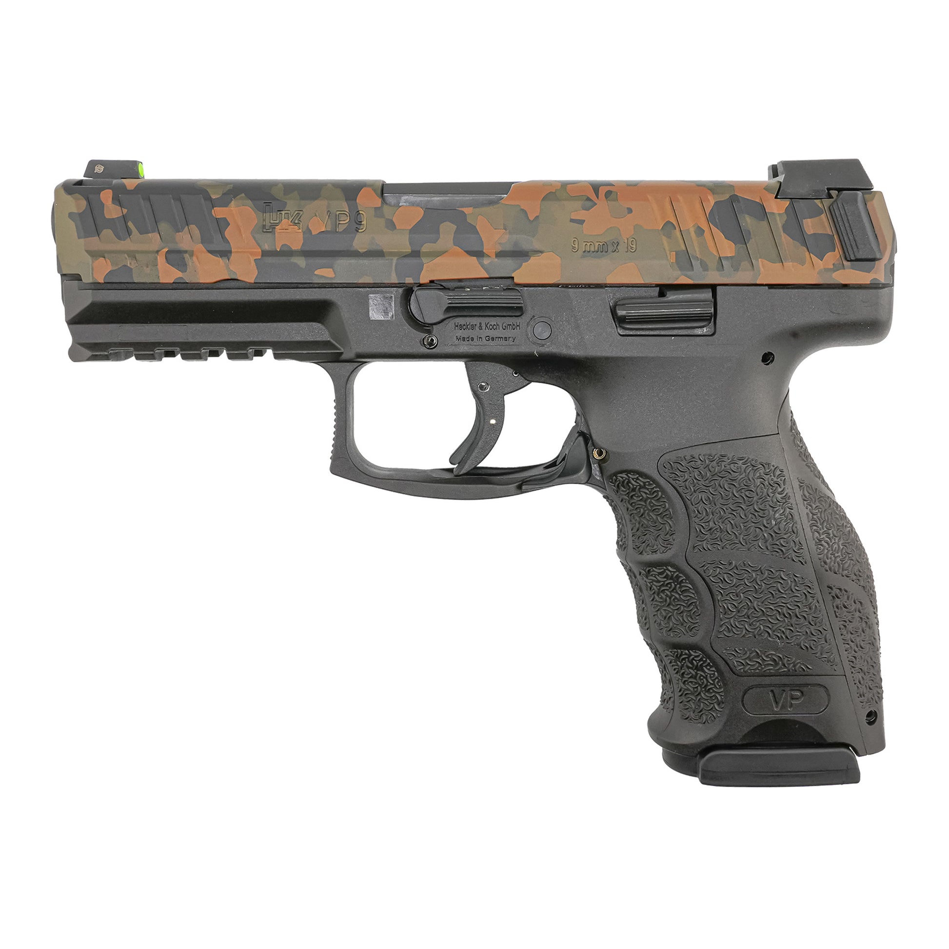 H&K VP9 FIREARM WITH A CAMO SLIDE ON A WHITE BACKGROUND.