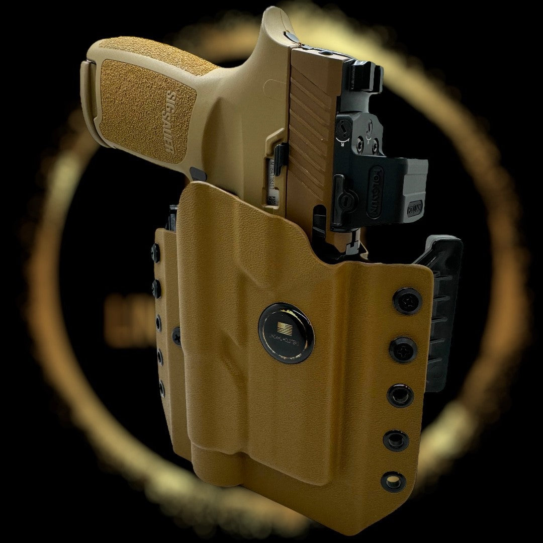 Tan holster with a gun inside on a black background