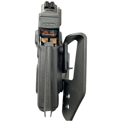 OWB paddle holster with magazine on a white background