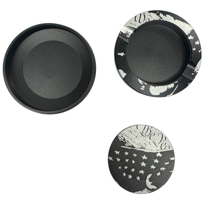 Set of three black and white patterned dishes on a white background