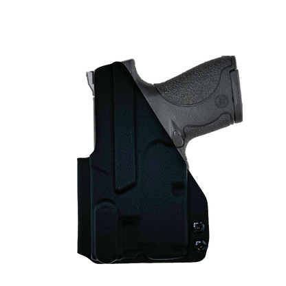 Black holster with a gun inside on a white background