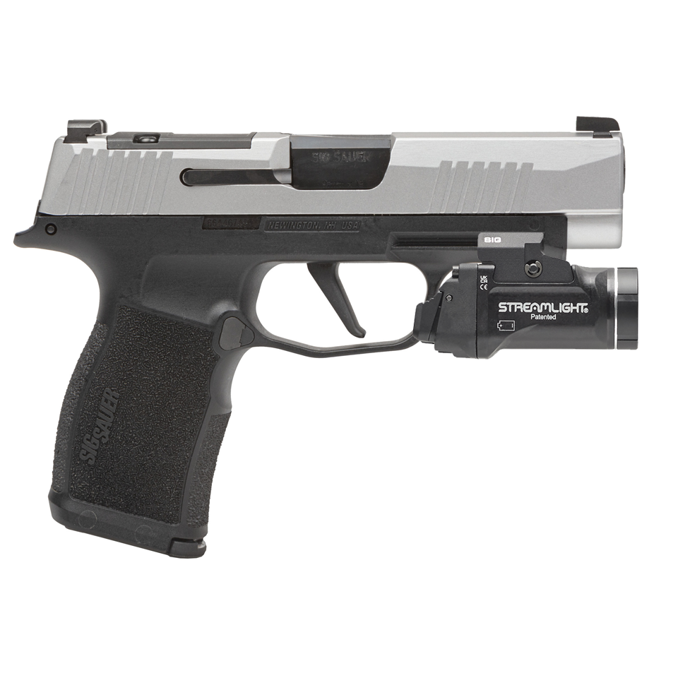 Handgun with a Streamlight flashlight attachment on a white background
