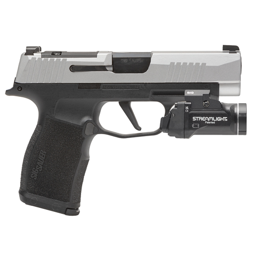 Handgun with a Streamlight flashlight attachment on a white background