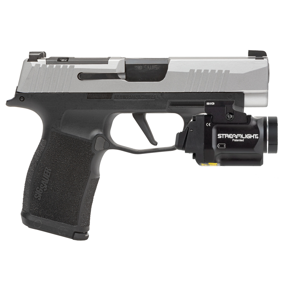 Handgun with Streamlight flashlight attachment on a white background