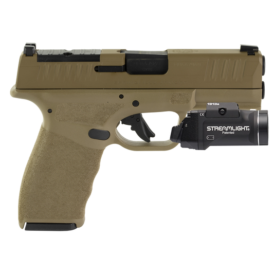 Tactical handgun with Streamlight light attachment on a white background