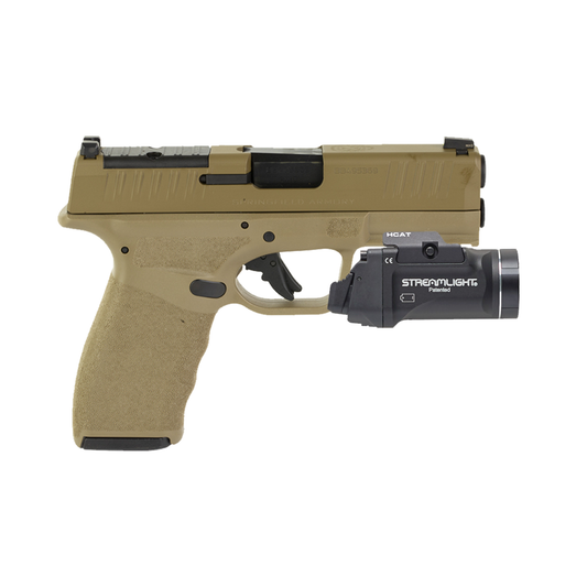 Tan handgun with Streamlight flashlight attachment on a white background
